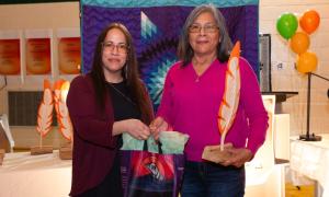 Rita Campbell receiving award