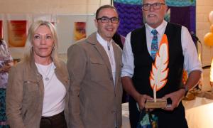 Andy Schardt receiving award