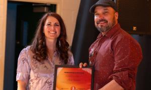 Jesse Fiddler receiving award