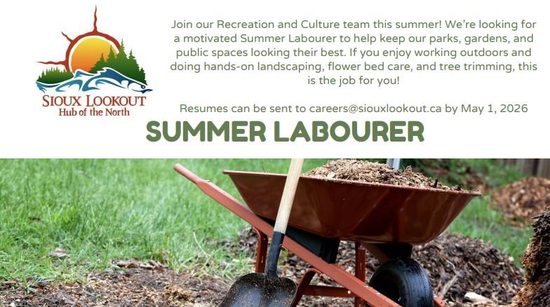 Wheelbarrow with mulch and shovel